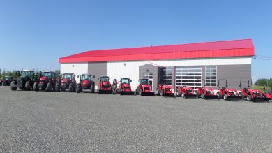 Massey Ferguson line up infront of a building