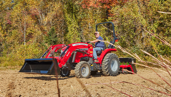 Massey Ferguson 1E Series compact tractor side profile, highlighting its robust build and versatility for demanding farming and landscaping tasks.
