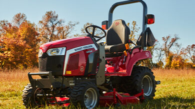 Massey Ferguson 1GC Series sub-compact tractor with a mid-mount mower deck, designed for efficient lawn maintenance and precision grass cutting in residential and small acreage settings.
