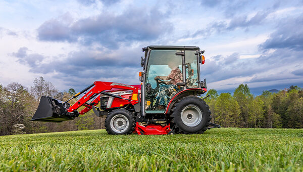 Massey Ferguson 1M Series compact tractor with an enclosed cab for all-weather comfort and year-round productivity, ideal for professional and small-scale farming.