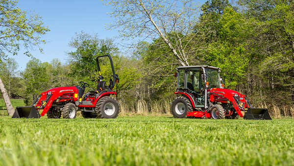 Two Massey Ferguson 1M Series compact tractors side by side, showcasing versatility for diverse agricultural and landscaping tasks.